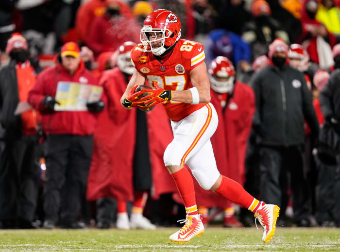 Kansas City Chiefs tight end Travis Kelce runs with the football.
